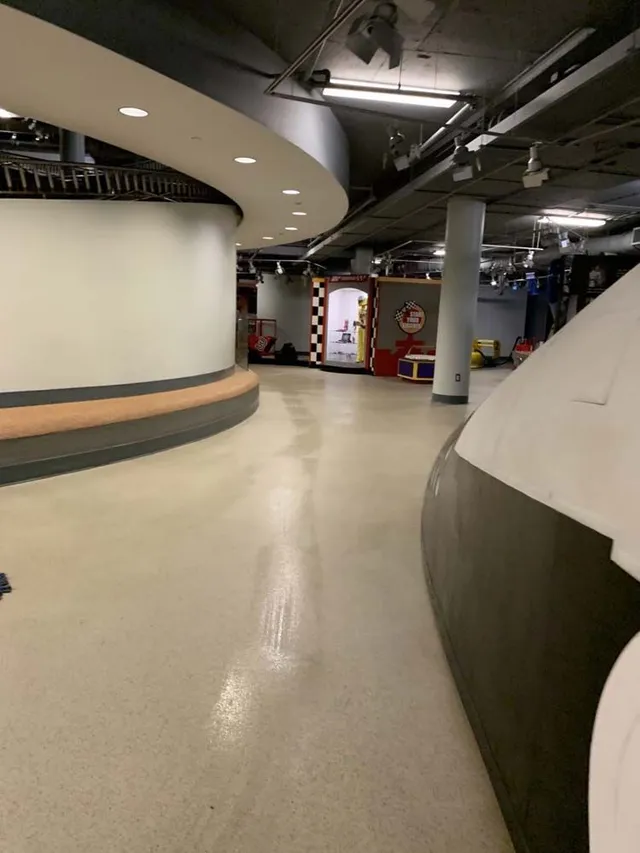 An empty hallway in a building with a circular ceiling